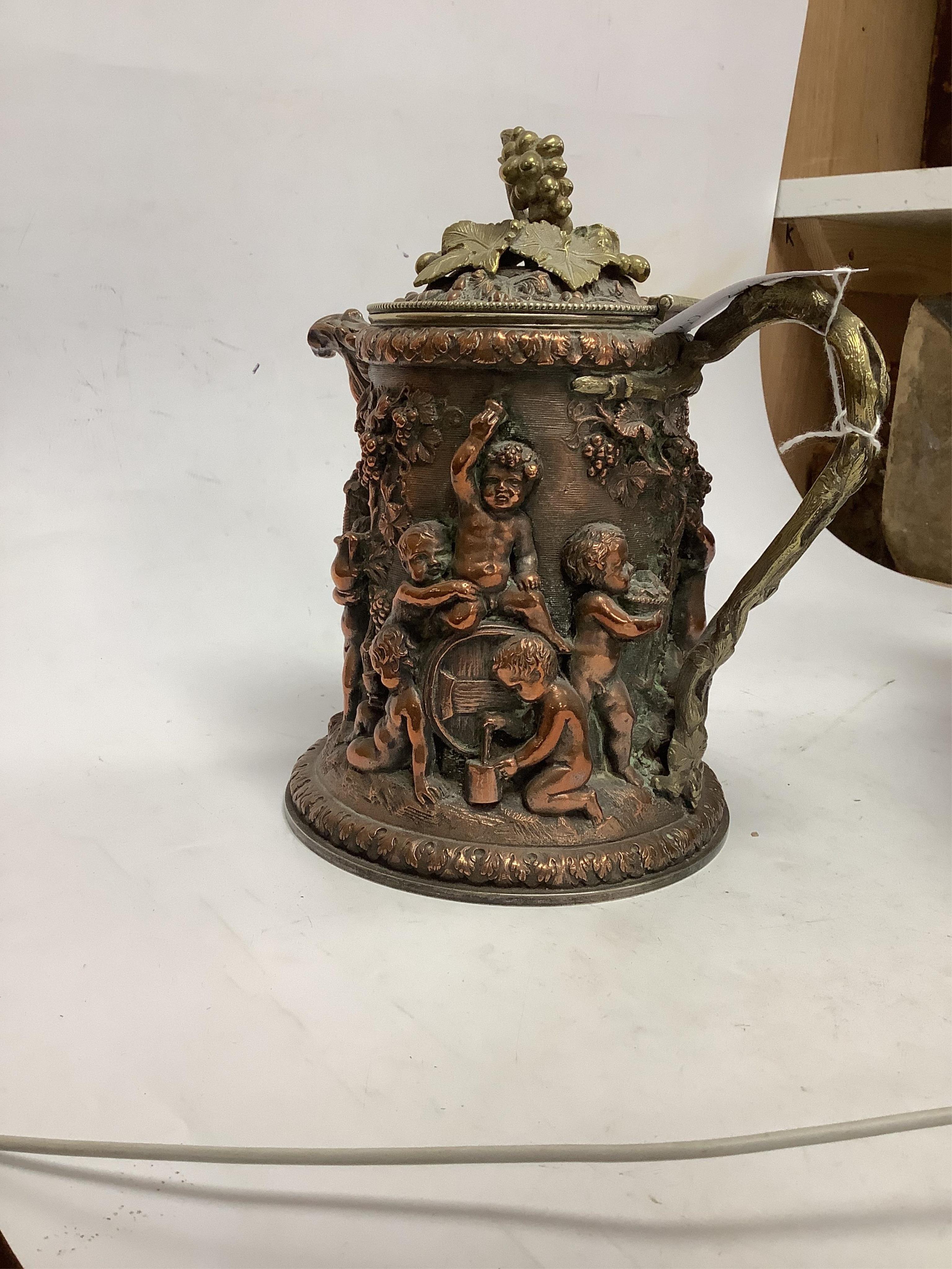 A copper Bacchus jug trophy, presentation inscription 1872, 21cm